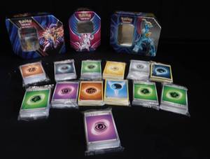 POKEMON TINS AND NEW ENERGY CARDS