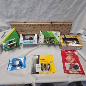 Lot of Die Cast Tractors in Packages as shown