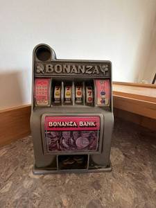 Vintage Bonanza Bank Slot Machine Coin Bank Gray Pink Countertop