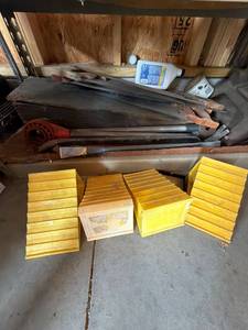 Box Lot of Assorted Pry Bars, Hand Saws & Plastic Wheel Chocks
