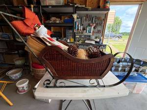Vintage-Style Woven Wicker Christmas Sleigh with Birch Logs and Decor