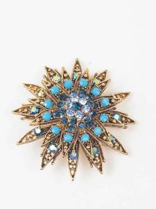 Gold Tone Blue Rhinestone Starburst Brooch