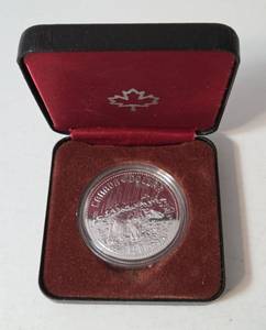 1980 Canada Polar Bear Queen Elizabeth II Proof Silver $1 Coin.  The  coin refers to the Canadian commemorative silver dollar issued in 1980. It celebrates the 100th anniversary of the transfer of the Arctic Territories from the United Kingdom to Canada.