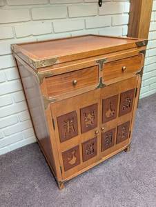 Asian-Style Wood Accent Cabinet With Carved Doors