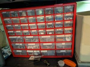 Red Hardware Organizer With Assorted Fasteners