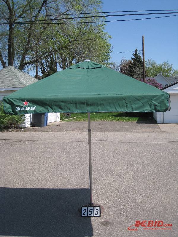 lot 253 image: Heinken Patio Umbrella - Base NOT included.  Heavy Duty fabric, Brand New in Box - Metal Frame, adjustable height. 68 x 68