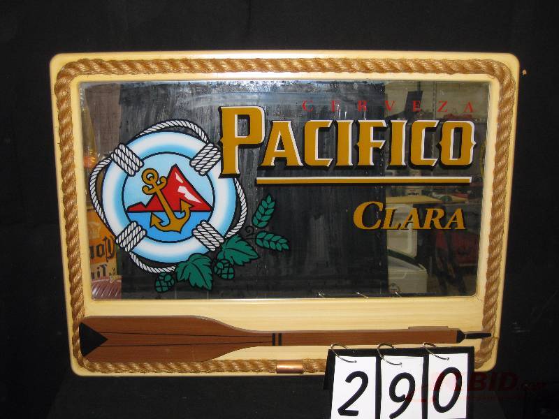 lot 290 image: Pacifico mirror with rope border and oar, some damage to lower right frame corner(white curtain in background reflection of mirror not part of graphics) 36 w x 27 h