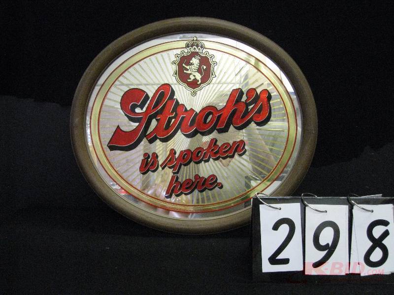 lot 298 image: Strohs Is Spoken Here oval mirror. (white curtain in background reflection of mirror not part of graphics) 21 w x 19 h