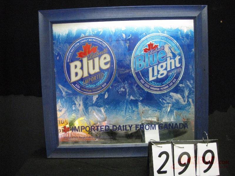 lot 299 image: Labatt Blue & Blue Light double logo mirror. (white curtain in background reflection of mirror not part of graphics) 31 w x 28 h