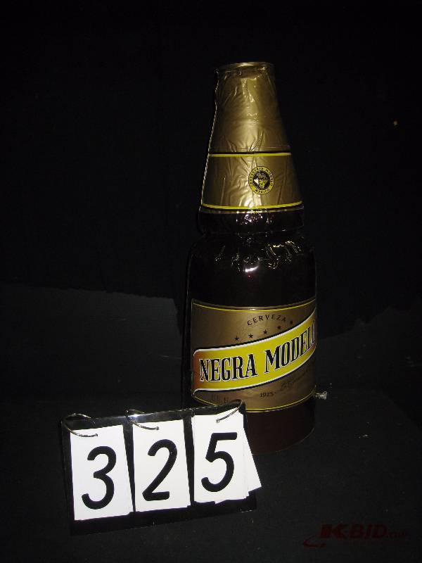 lot 325 image: Modelo Negra inflatable bottle