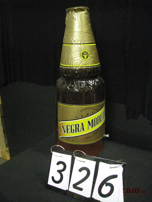 lot 326 image: Modelo Negra inflatable bottle