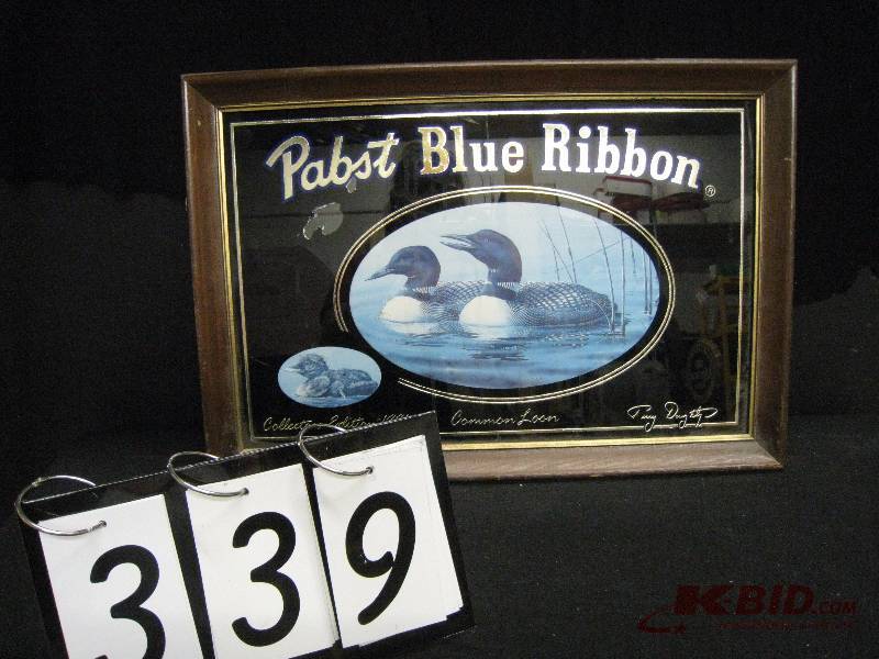 lot 339 image: Pabst Blue Ribbon wildlife collection - 1991 common loon, limited edition, a little damage to back. (white curtain in background reflection of mirror not part of graphics) 22 w x 16 h