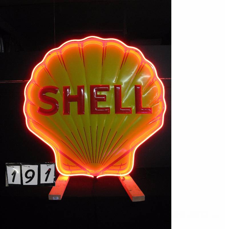 lot 191 image: Shell Oil fiberglass clamshell, embossed. Reproduction of porcelain original. Extremely Nice Custom wall hanging brackets.