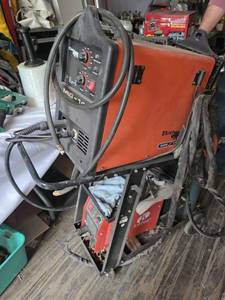 Rhino MIG-145 Welder and Lotos LTP5000D Plasma Cutter on Cart - Both Work, Back Cover is Off Welder
