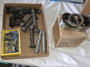 Lot of Trailer Parts Including Wheel Seals, Bolts, and Valves