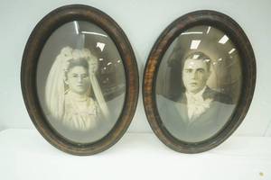 Pair of oval antique photograph prints. 17x 23