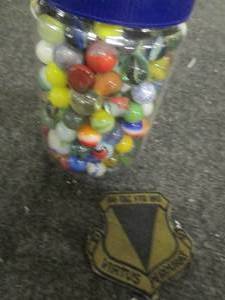 Jar of marbles and a vintage patch...