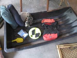 Otter Sport ice fishing sled with a...
