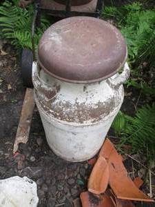 Vintage metal milk can with lid...