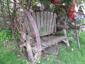 Rustic barnwood and metal wagon whe...