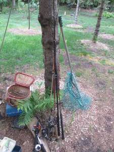 Assortment of Fishing poles and emp...