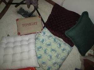 Stack of padded seat cushions...