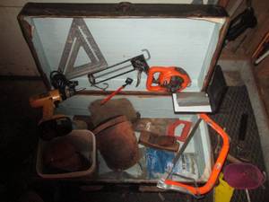 Vintage footlocker trunk, hand saws...