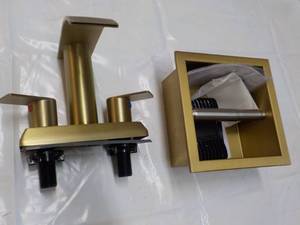 Gold Bathroom Faucet and Toilet Hol...