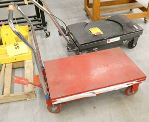 Red hydraulic table lift cart with foot pump