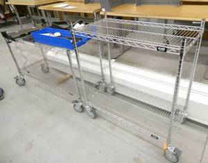 2 wire shelving carts on wheels and contents