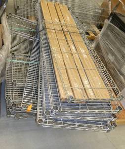Pallet of various wire shelves and 4 new boxes of posts