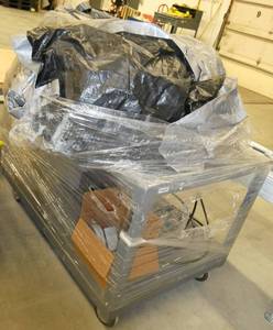 Rolling steel cart with a tarp on top and misc items below including a enclosed transformer 6.4kva 3ph 230V