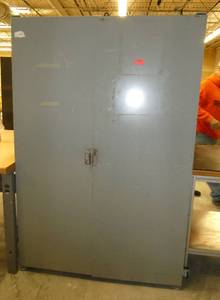 Two door parts storage cabinet lined with parts bin hangers