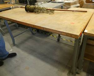 72x36 Workbench with wood top and steel legs, and a roll of speaker wire