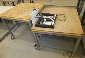 Two rolling tables 30x30 and 30x38, wood top steel base
