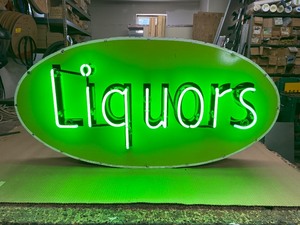 Liquors neon sign with original  vintage porcelain face