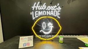 Huberts Lemonade neon sign with smiley lemon
