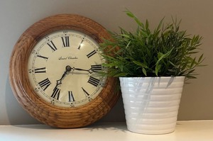 LBR1 - Saint Charles Wall Clock With Faux Greenery in White Ceramic Planter