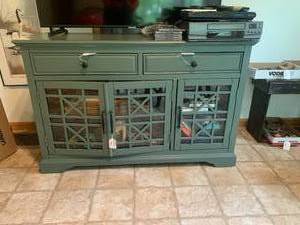 Wood TV stand/cabinet on rollers...