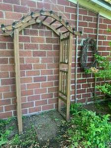 Wood arbor (has been sitting outsid...