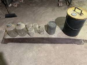 Vintage glass jars, saw and metal o...
