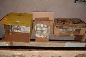 Canning jars all on shelf and 4 bo...