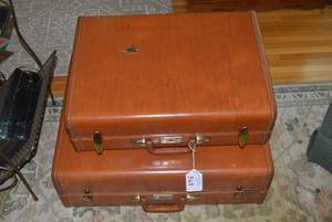 Sampson suitcases with military clo...