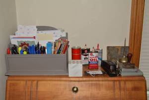 All items on top of desk - oil cans...