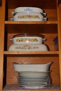Casseroles and plates all on 3 she...