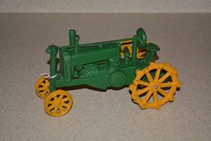 Reproduction cast iron toy tractor...