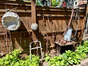 Contents of Fence - Antique Primitive items, Cast iron, Antique Hay Loaders etc