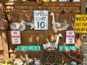 Contents of Fence Wall - Primitives, Antiques, Signs Cast Iron Items etc