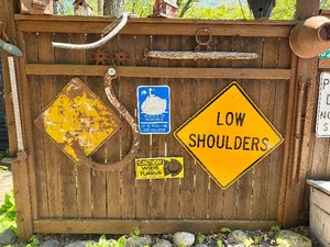 Contents of Fence Wall - Primitives, Antiques, Signs Cast Iron Items etc