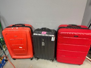 Large Rolling Suitcases Two Samsonite, One Delsey.  Large Red Samsonite missing front wheel.  30 x 20 x 12, 30 X 20 x 13, 26 x 17 x 11